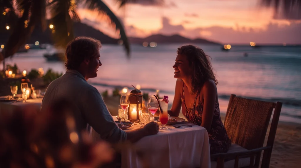 Couple enjoying a romantic candlelit dinner on the beach.